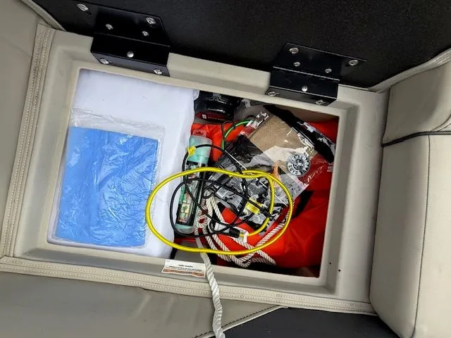 Slide: The Image of Storage compartment in 2024 Barletta Aria with cables and accessories. - 18
