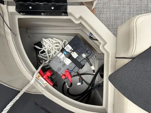 Slide: The Image of Battery compartment in 2024 Barletta Aria boat with cables and rope. - 20