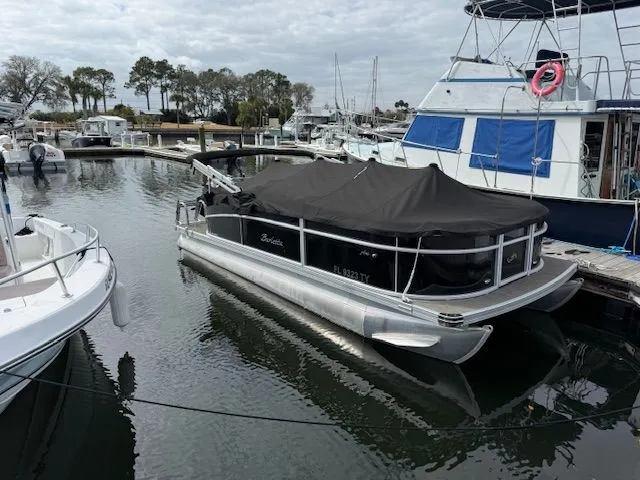 Slide: The Image of 2024 Barletta Aria pontoon boat docked in marina. - 3
