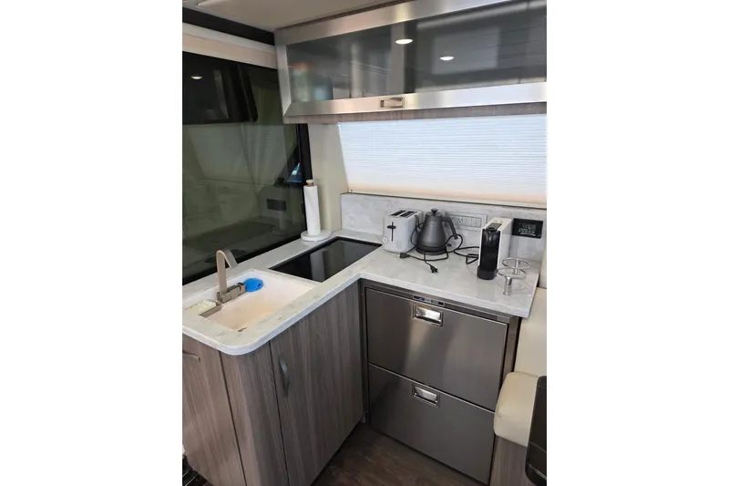 Slide: The Image of Modern kitchen interior of 2021 Regal 38 Grande Coupe yacht. - 17