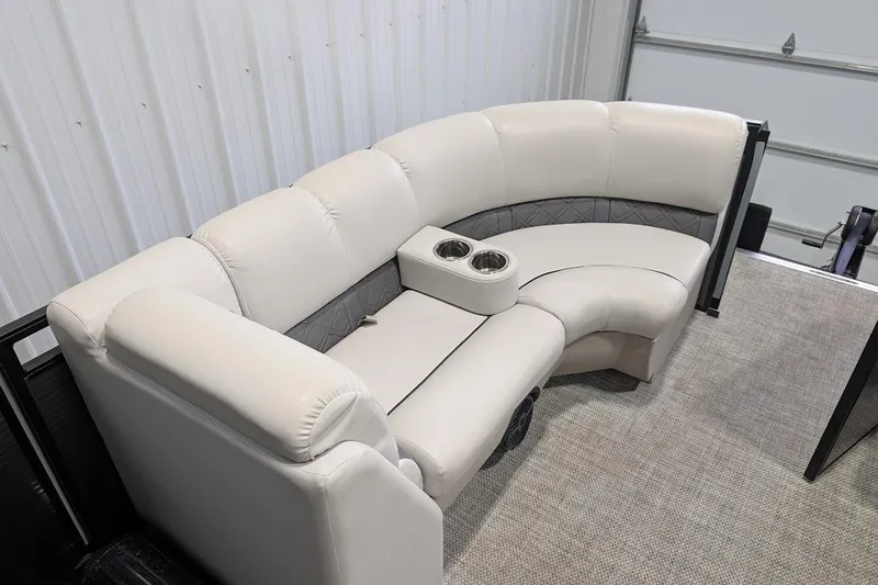 Slide: The Image of Luxurious seating on 2018 Lund LX220 Pontoon with cup holders and plush upholstery. - 13