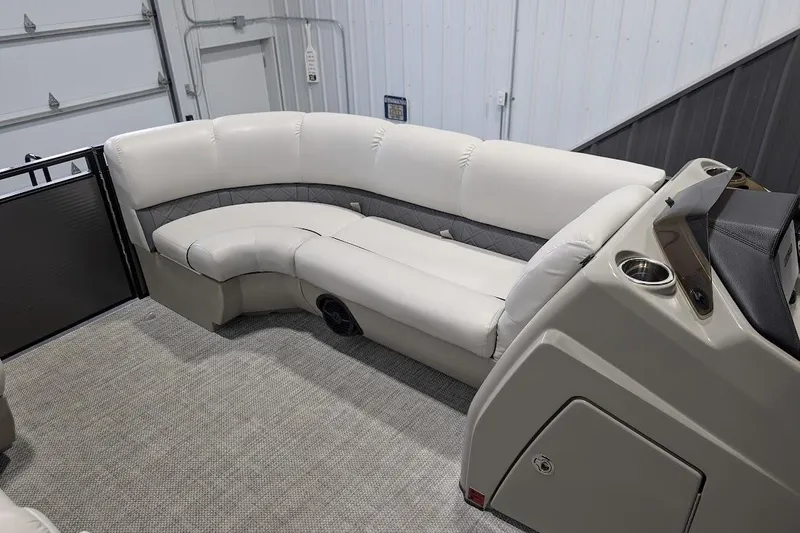 Slide: The Image of 2018 Lund LX220 Pontoon interior with plush seating and modern console design. - 14