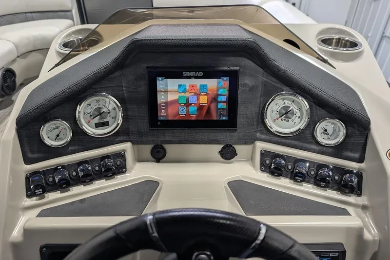 Slide: The Image of 2018 Lund LX220 Pontoon dashboard with gauges and Simrad display. - 19
