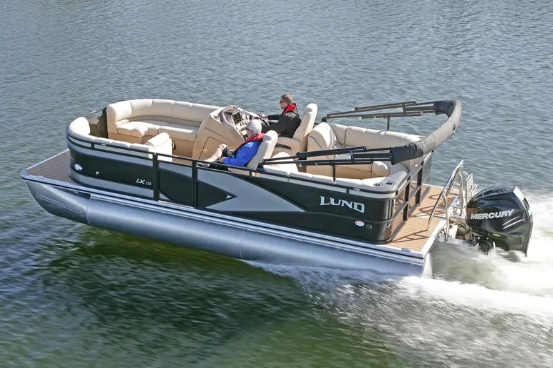 Slide: The Image of Manufacturer Provided Image: 2018 Lund LX220 Pontoon boat cruising on water. - 43