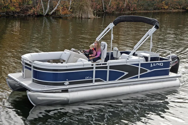 Slide: The Image of Manufacturer Provided Image: 2018 Lund LX220 Pontoon boat on a calm lake. - 44