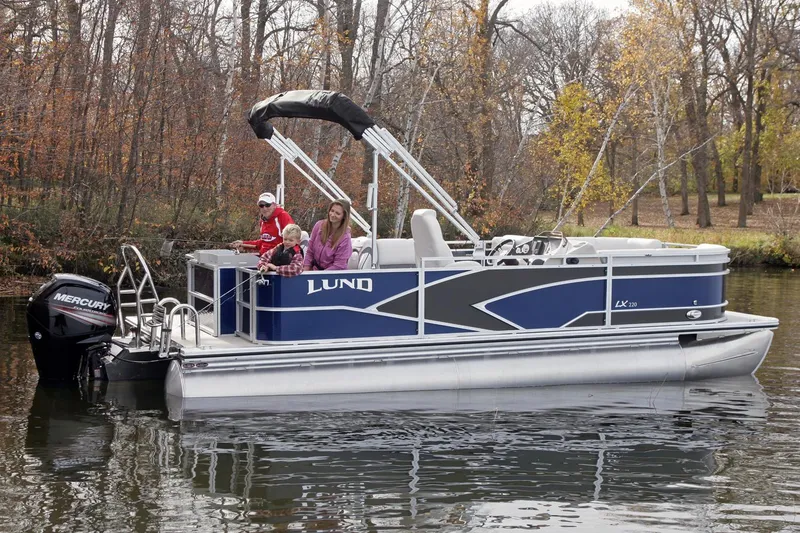 Slide: The Image of Manufacturer Provided Image: 2018 Lund LX220 Pontoon boat on a calm lake with passengers. - 45