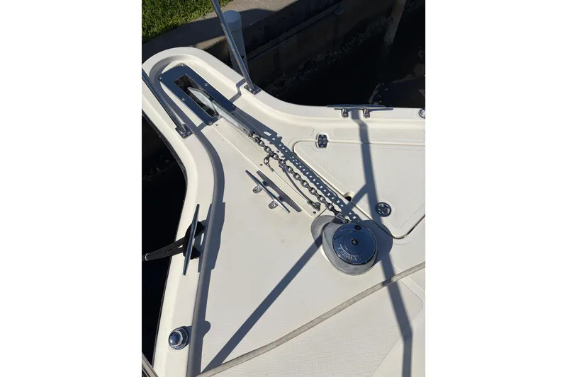 Slide: The Image of 2005 Pursuit 3370 Offshore boat deck with anchor chain and winch system. - 31