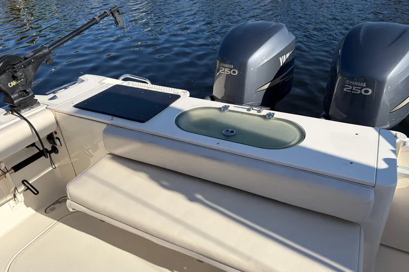 Slide: The Image of 2005 Pursuit 3370 Offshore boat with Yamaha 250 engines, featuring a fishing setup. - 4