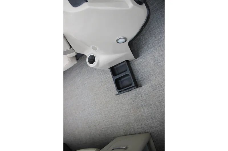 Slide: The Image of Interior of 2022 Baretta Cabrio C22CC boat with cup holders and beige flooring. - 11