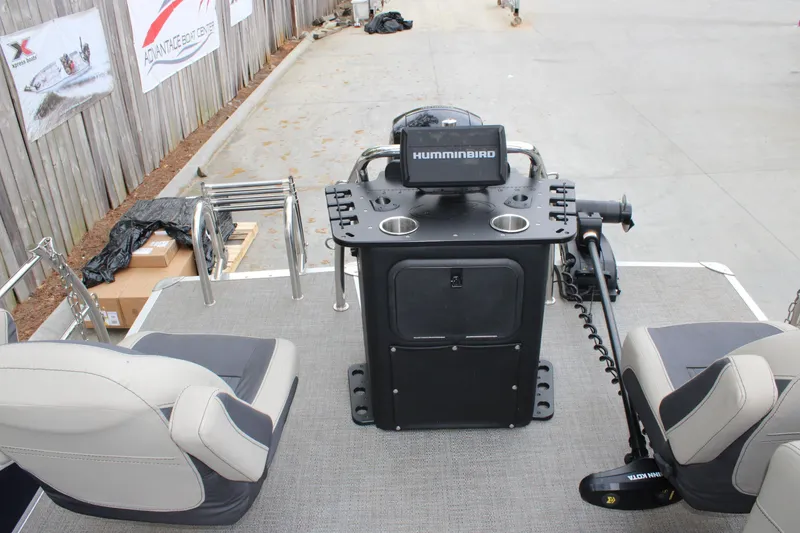 Slide: The Image of 2022 Baretta Cabrio C22CC boat interior with Humminbird console and seating arrangement. - 12