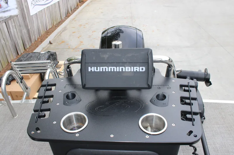 Slide: The Image of 2022 Baretta Cabrio C22CC boat console with Humminbird fish finder and cup holders. - 14