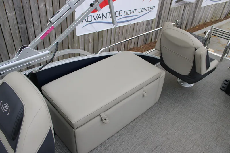 Slide: The Image of 2022 Baretta Cabrio C22CC boat interior with seating and storage, displayed at Advantage Boat Center. - 17