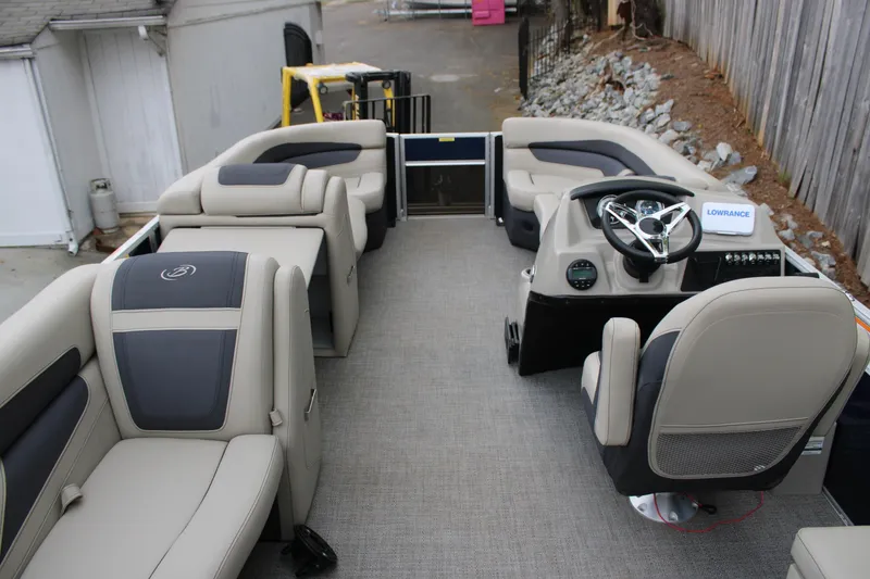 Slide: The Image of 2022 Baretta Cabrio C22CC boat interior with plush seating and modern steering console. - 20