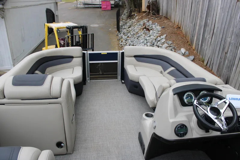 Slide: The Image of 2022 Baretta Cabrio C22CC pontoon boat interior with plush seating and modern dashboard. - 5