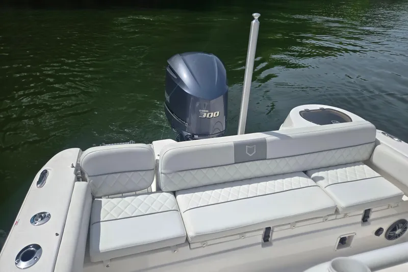 Slide: The Image of 2024 Sea Fox 248 Side Console dashboard with steering wheel, navigation system, and controls. - 16