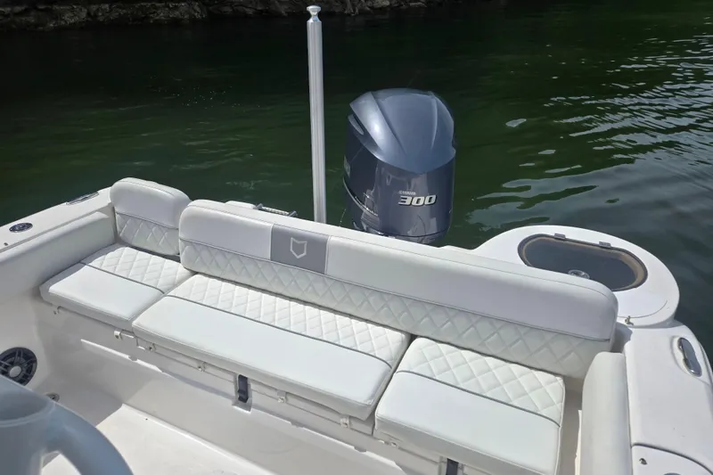 Slide: The Image of 2024 Sea Fox 248 Side Console boat interior with steering wheel and seating. - 17