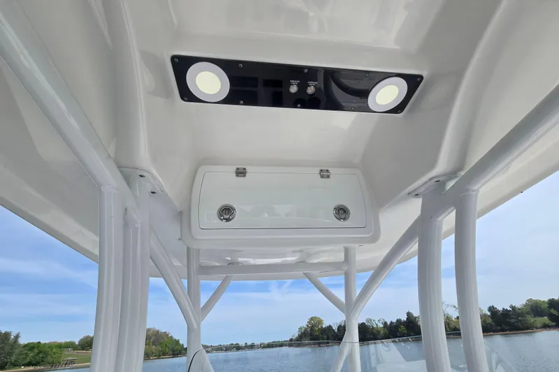 Slide: The Image of 2024 Sea Fox 248 Side Console boat interior with overhead storage and lighting. - 18