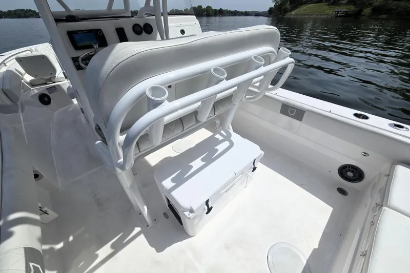 Slide: The Image of 2024 Sea Fox 248 Side Console boat interior with seating and rod holders. - 20