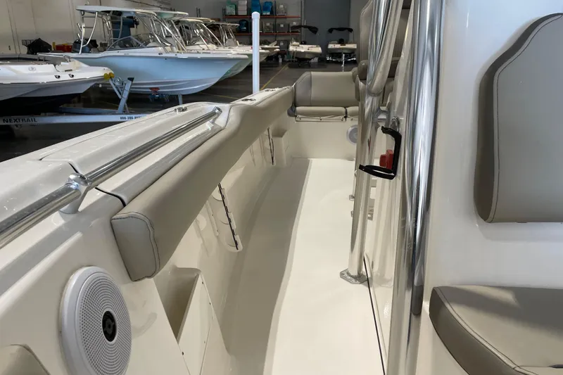 Slide: The Image of 2024 Key West 239 FS boat interior with seating and stainless steel railings. - 13