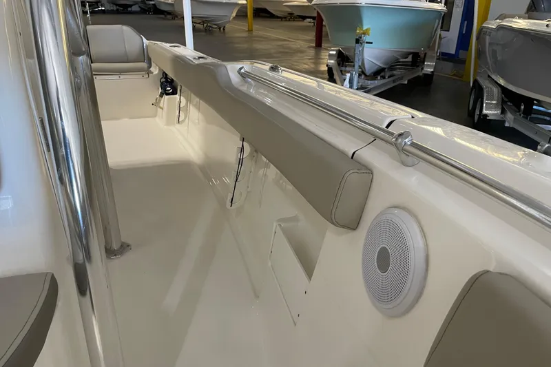 Slide: The Image of 2024 Key West 239 FS boat interior with seating and speaker detail. - 14