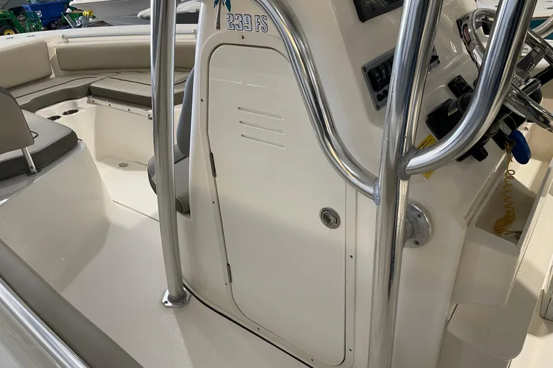 Slide: The Image of 2024 Key West 239 FS boat interior with seating and control panel. - 15