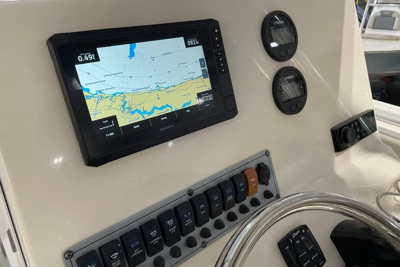 Slide: The Image of 2024 Key West 239 FS boat dashboard with Garmin navigation display and control panel. - 19
