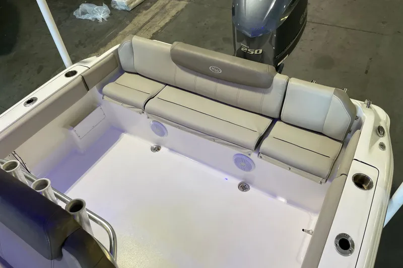 Slide: The Image of 2024 Key West 239 FS boat interior with cushioned seating and Yamaha 250 engine. - 22