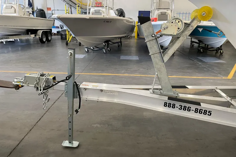 Slide: The Image of 2024 Key West 239 FS boat on trailer in indoor showroom. - 24