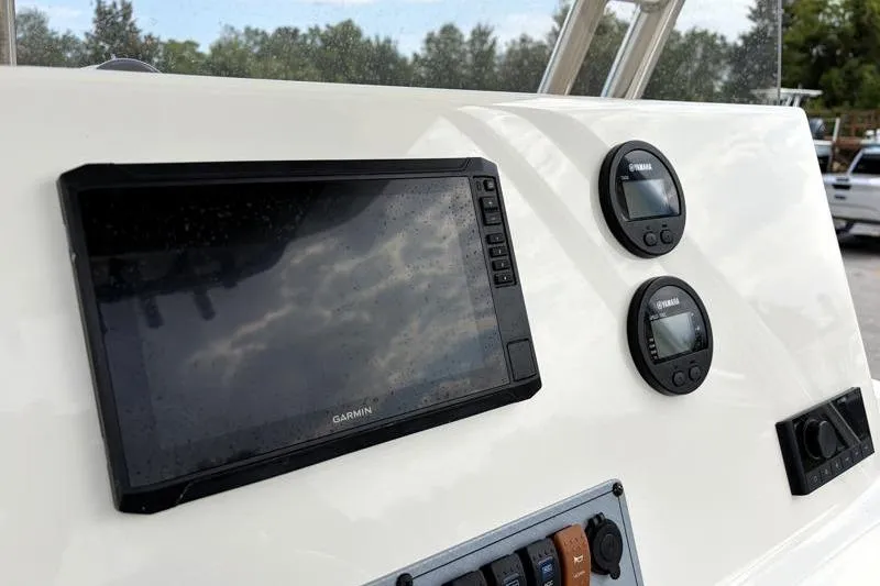 Slide: The Image of 2024 Key West 239 FS boat dashboard with Garmin and Yamaha displays. - 28