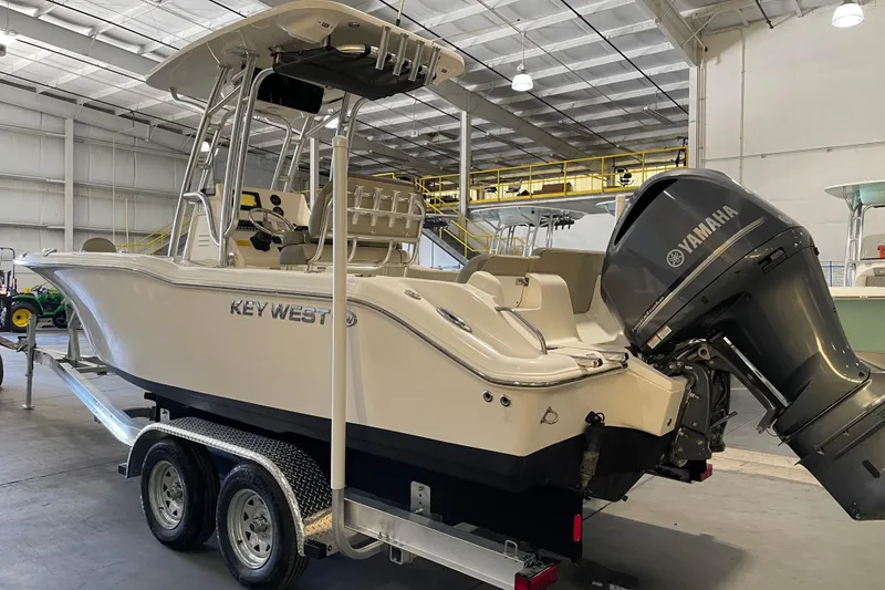 Slide: The Image of 2024 Key West 239 FS boat with Yamaha engine on trailer in warehouse. - 3