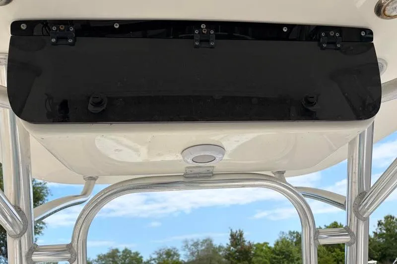 Slide: The Image of 2024 Key West 239 FS boat's T-top underside with black panel and metal frame. - 31