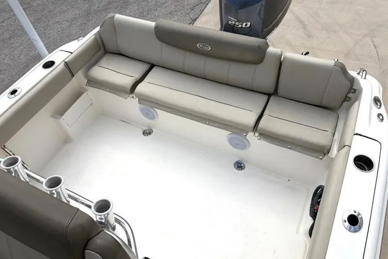 Slide: The Image of 2024 Key West 239 FS boat interior with cushioned seating and rod holders. - 33