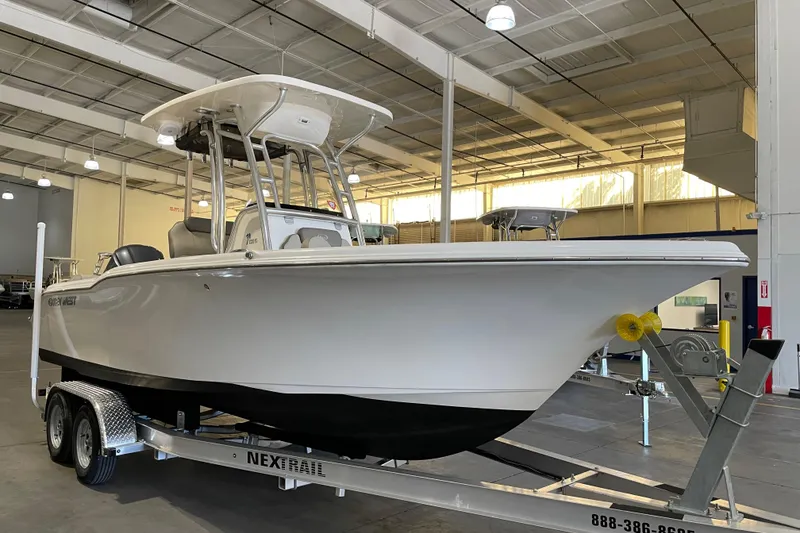 Slide: The Image of 2024 Key West 239 FS boat on trailer in indoor showroom. - 4