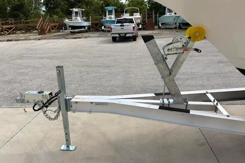 Slide: The Image of 2024 Key West 239 FS boat trailer with winch in parking lot. - 41