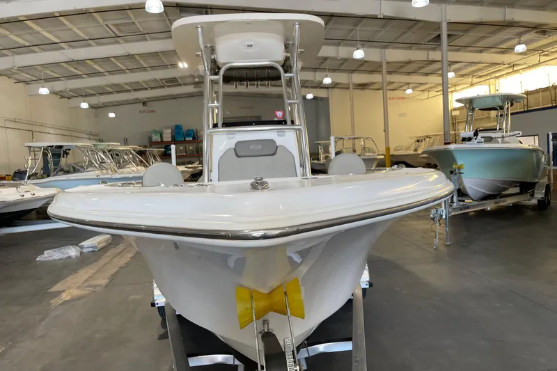 Slide: The Image of 2024 Key West 239 FS boat displayed in a showroom, showcasing sleek design and modern features. - 5