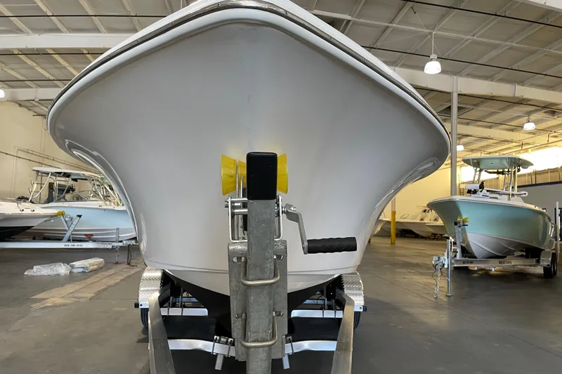 Slide: The Image of 2024 Key West 239 FS boat in showroom, front view on trailer. - 6