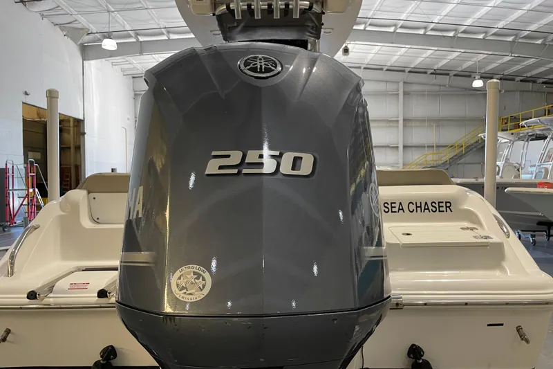 Slide: The Image of 2024 Key West 239 FS boat with Yamaha 250 engine in a showroom. - 8
