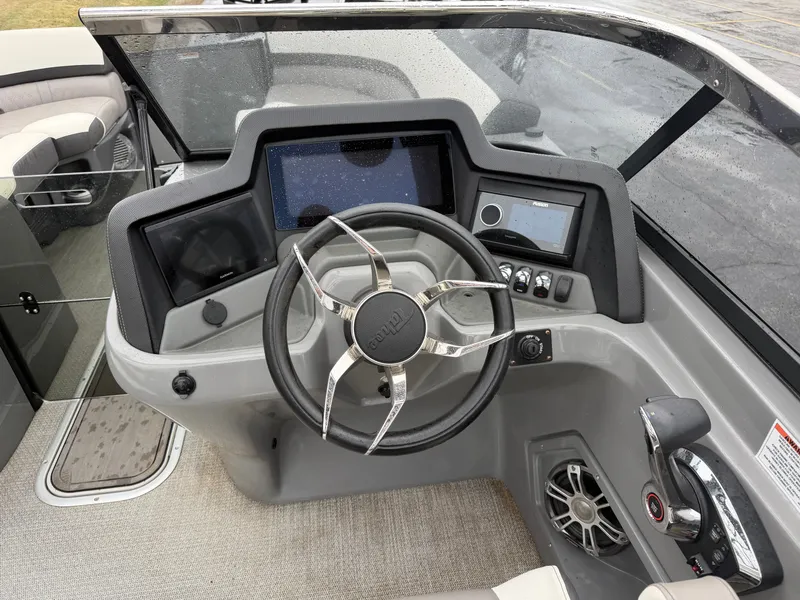 Slide: The Image of 2023 Tahoe WAKETOON boat steering console with modern features. - 10
