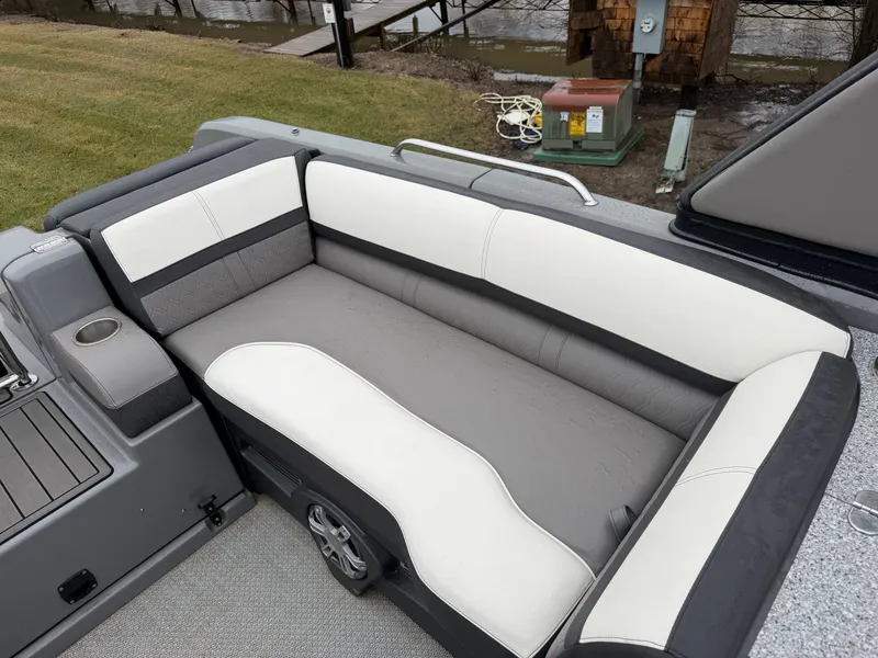 Slide: The Image of 2023 Tahoe WAKETOON boat with gray and white seating area. - 11