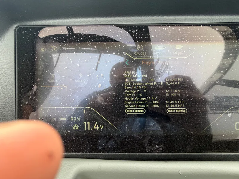 Slide: The Image of 2023 Tahoe WAKETOON dashboard with digital displays and water droplets. - 15