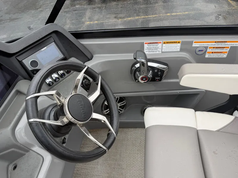 Slide: The Image of 2023 Tahoe WAKETOON helm with steering wheel and controls. - 16
