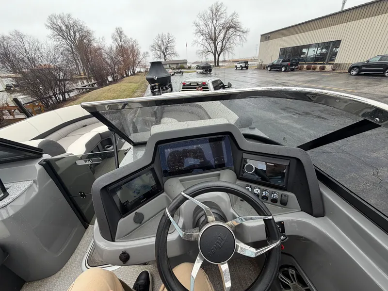 Slide: The Image of Interior view of 2023 Tahoe WAKETOON boat with modern control console. - 17