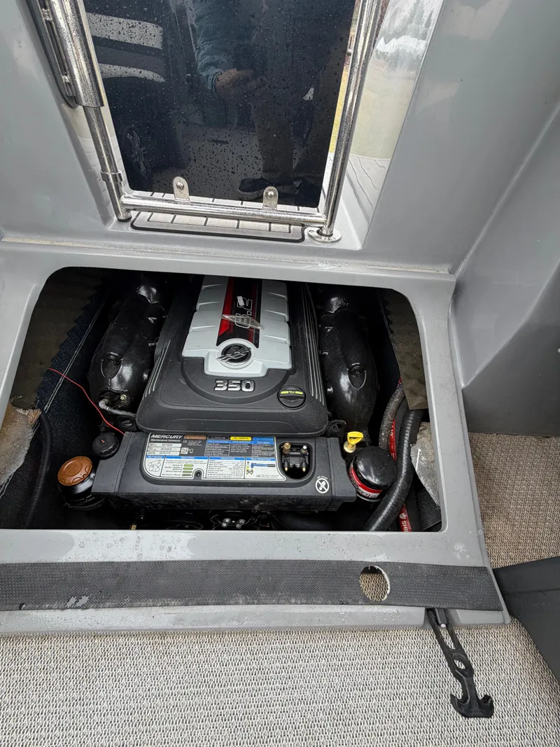 Slide: The Image of Engine compartment of a 2023 Tahoe WAKETOON boat with 350 HP engine. - 19