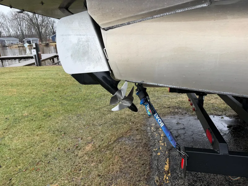 Slide: The Image of 2023 Tahoe WAKETOON boat with propeller and trailer. - 2