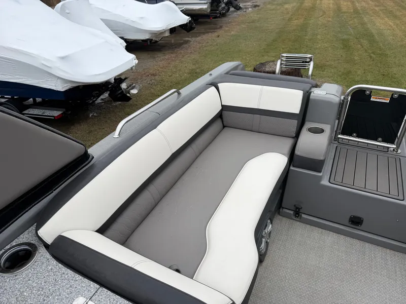 Slide: The Image of 2023 Tahoe WAKETOON boat with gray and white seating area. - 7