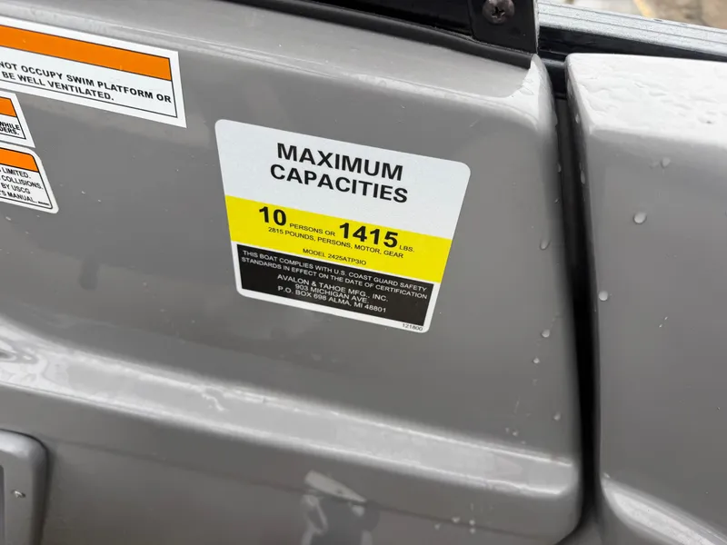 Slide: The Image of 2023 Tahoe WAKETOON boat capacity label, maximum persons and weight allowance. - 8