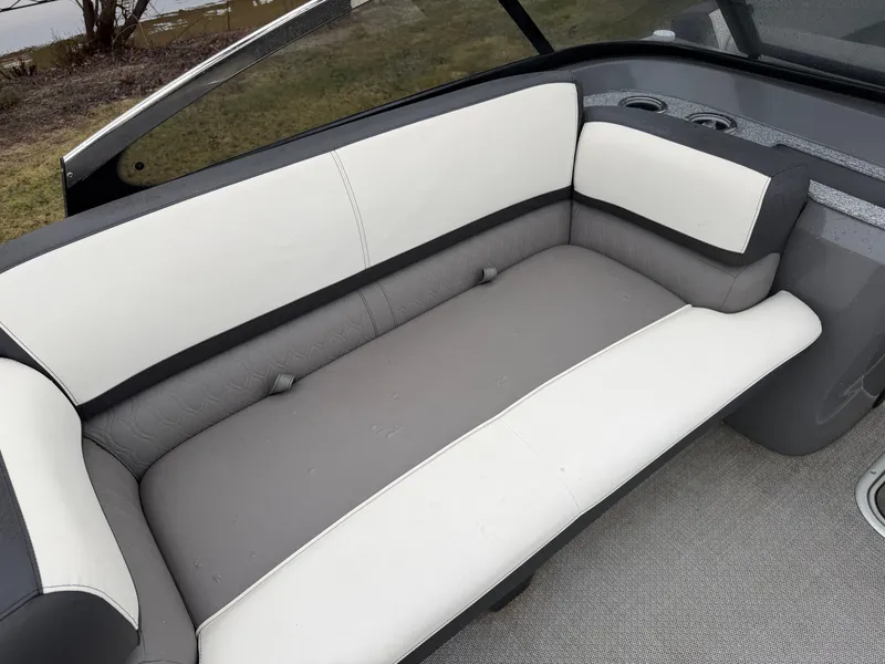 Slide: The Image of Interior of 2023 Tahoe WAKETOON boat with gray and white seating. - 9