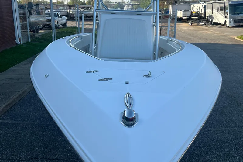 Slide: The Image of 2006 Fountain 23 Center Console boat, white exterior, parked outdoors. - 13