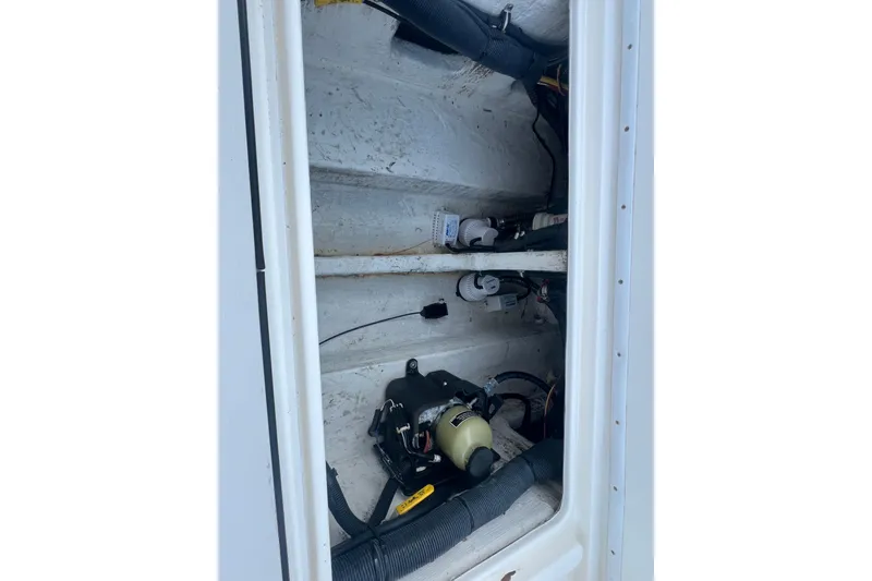 Slide: The Image of 2006 Fountain 23 Center Console boat interior wiring and components view. - 16