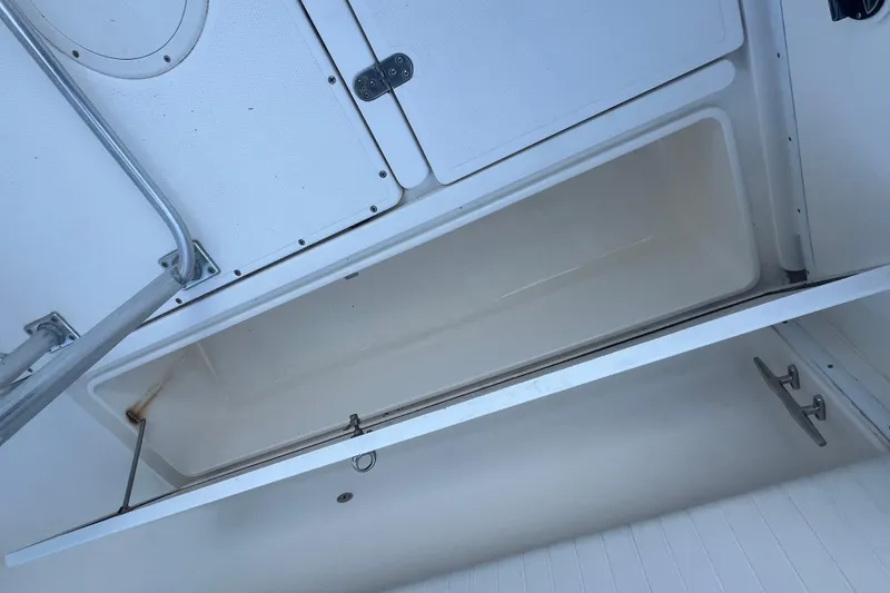 Slide: The Image of Open storage compartment on a 2006 Fountain 23 Center Console boat. - 20